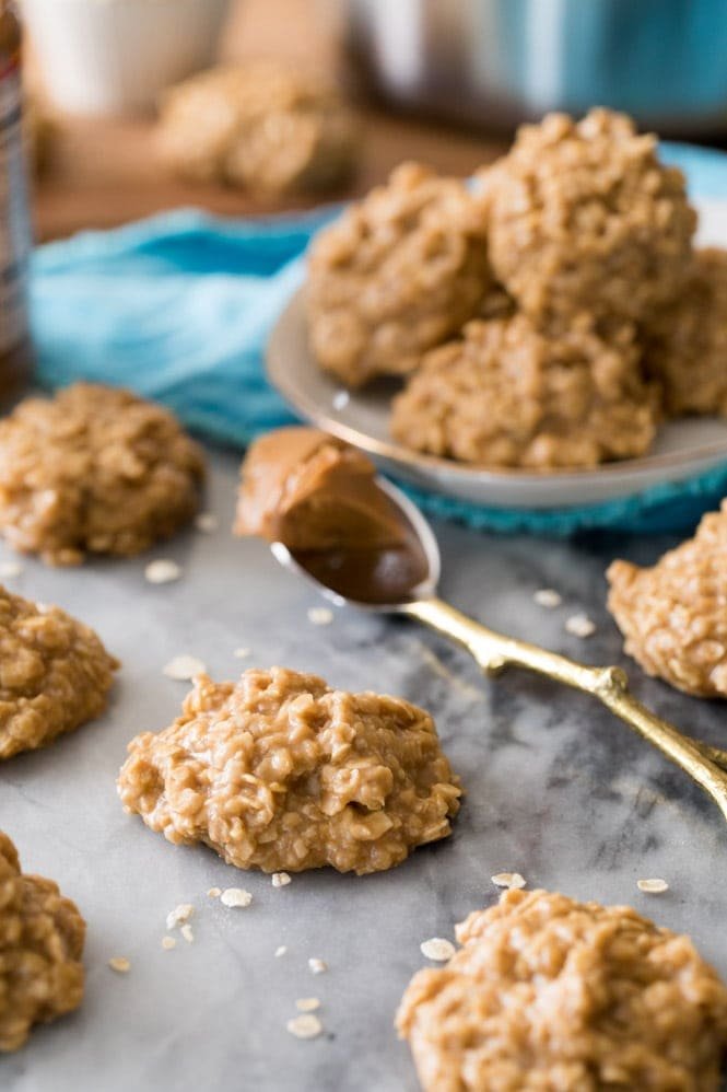 These no-bake cookies are made with COOKIE BUTTER! Such a fun new flavor and such easy cookies, no oven required! #cookiebutter #cookierecipe #sugarspunrun Cookie Butter No bake cookies being served on marble board
