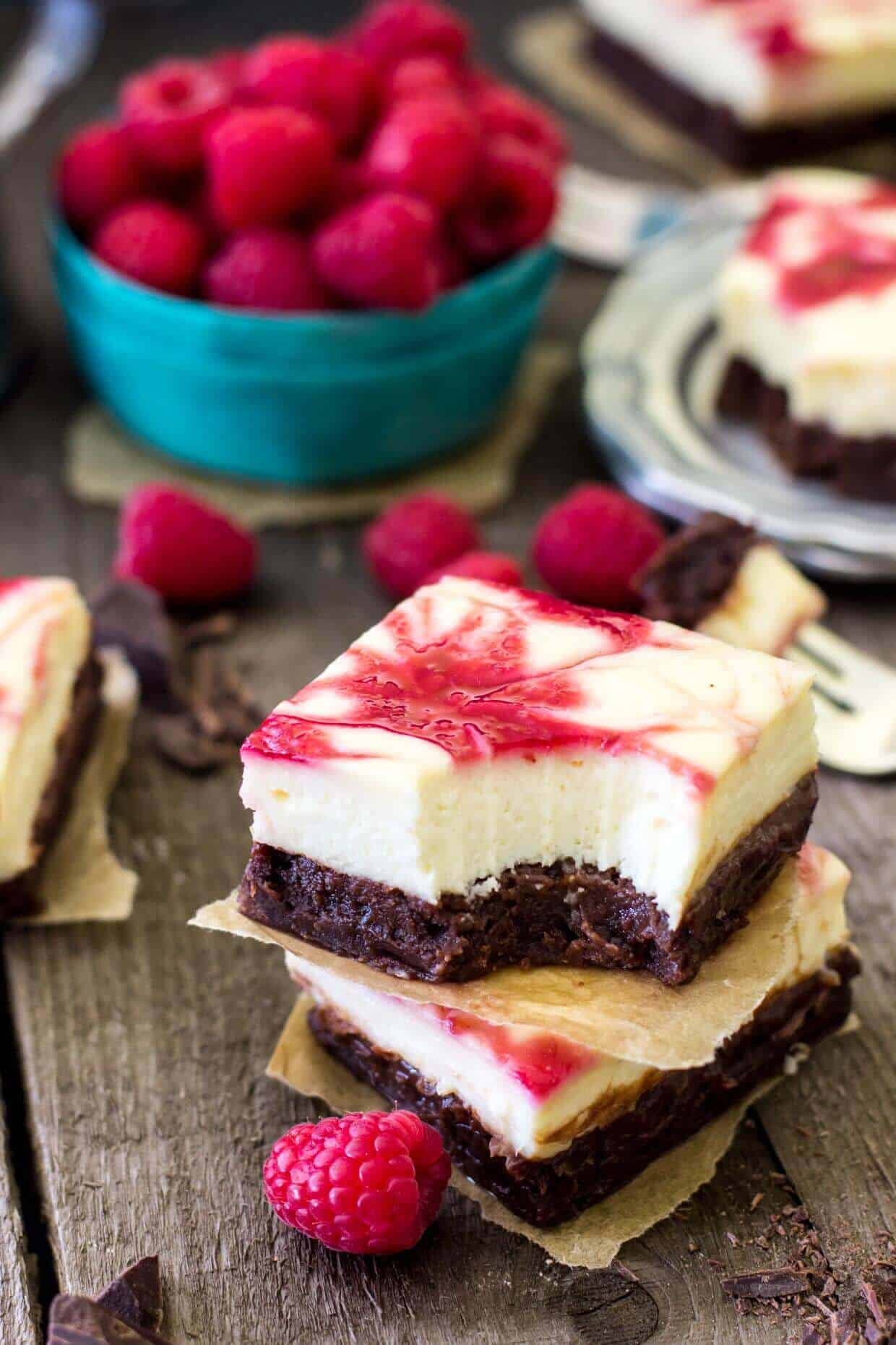 Raspberry Cheesecake Brownies on wood background