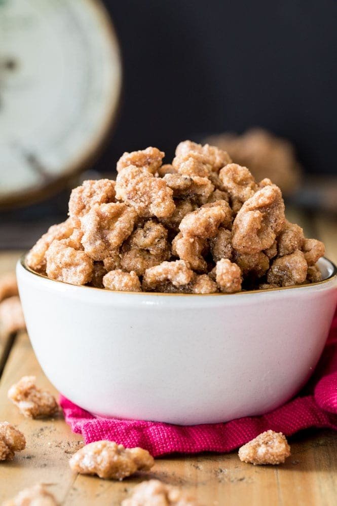 How to make Candied Walnuts -- these are so easy to make and everyone loves them! A great giftable treat! Candied walnuts in a white bowl