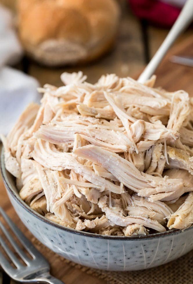 Crock Pot Shredded Chicken! It's so easy to make shredded chicken in your slow cooker! A bowl of shredded chicken