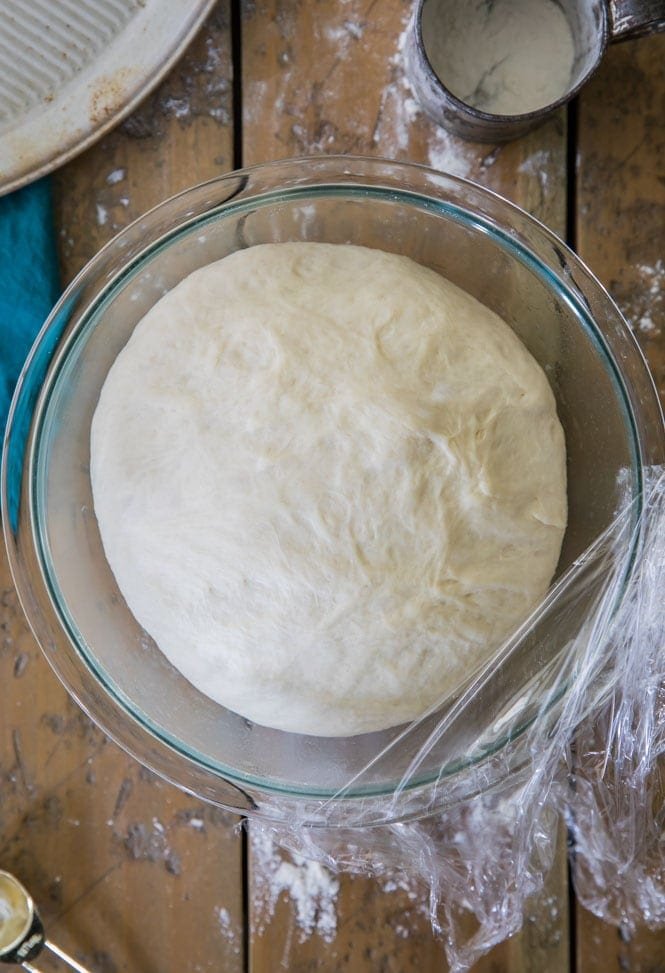 How to make the BEST, easiest pizza dough recipe. 10 minutes to prep and 30 minutes to rise for a this foolproof pizza dough! #pizzadough #pizza #baking #dinnerrecipe #easydinner Pizza Dough Recipe with dough after it's risen