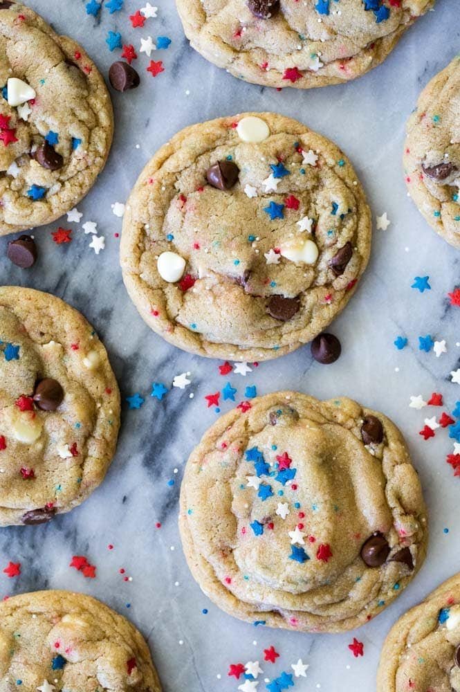 Festive Red White & Blue Chocolate Chip Cookies would be a perfect 4th of July dessert! #4thofjuly #fourthofjuly #redwhiteandblue #fourthofjulydessert #partyfood #recipe #baking Red White and Blue Cookies