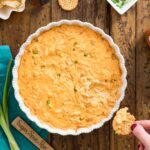 overhead of buffalo chicken dip in white dish.