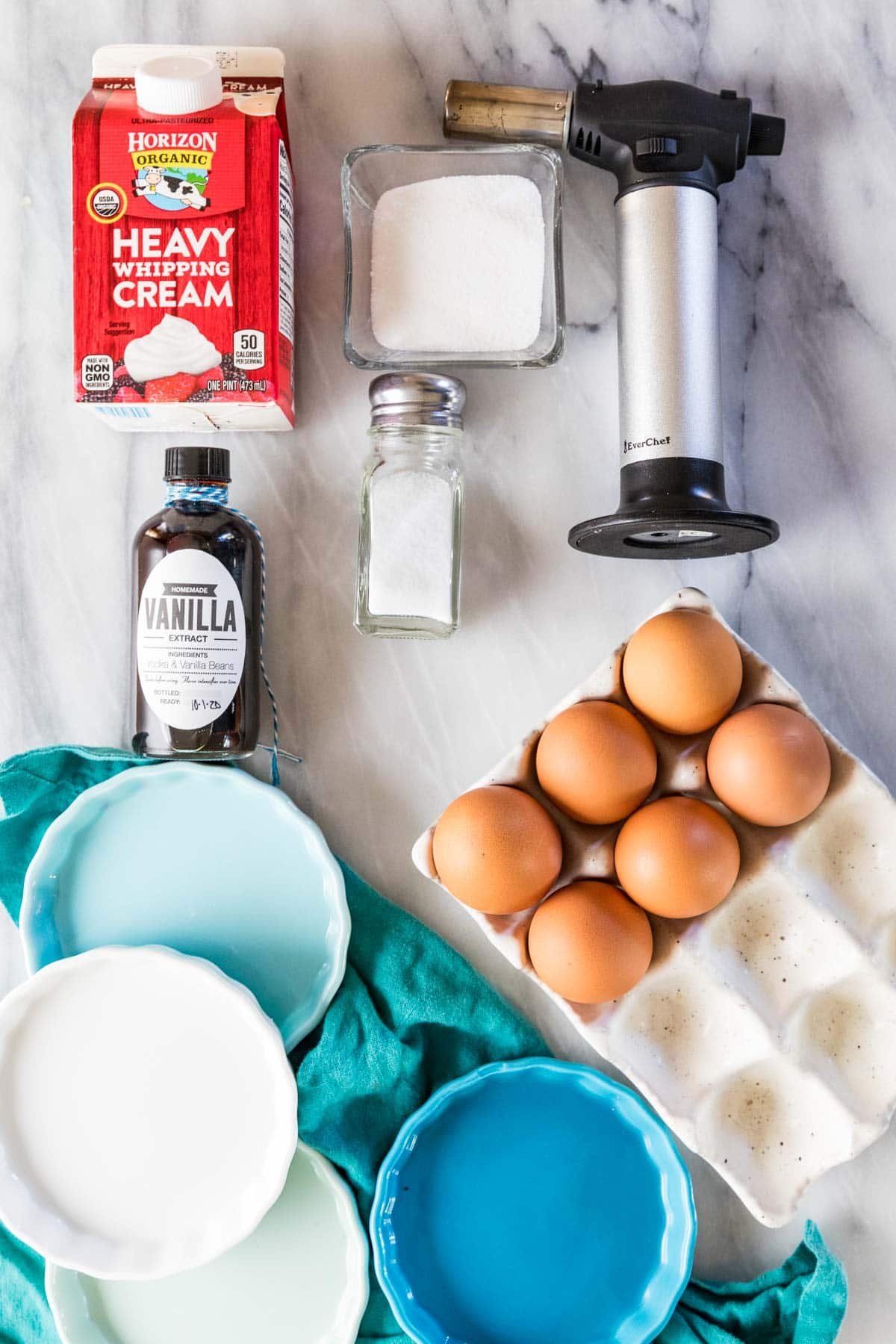Ingredients and materials needed for making creme brulee