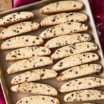 overhead view of homemade biscotti cookies cooling on a cookie sheet