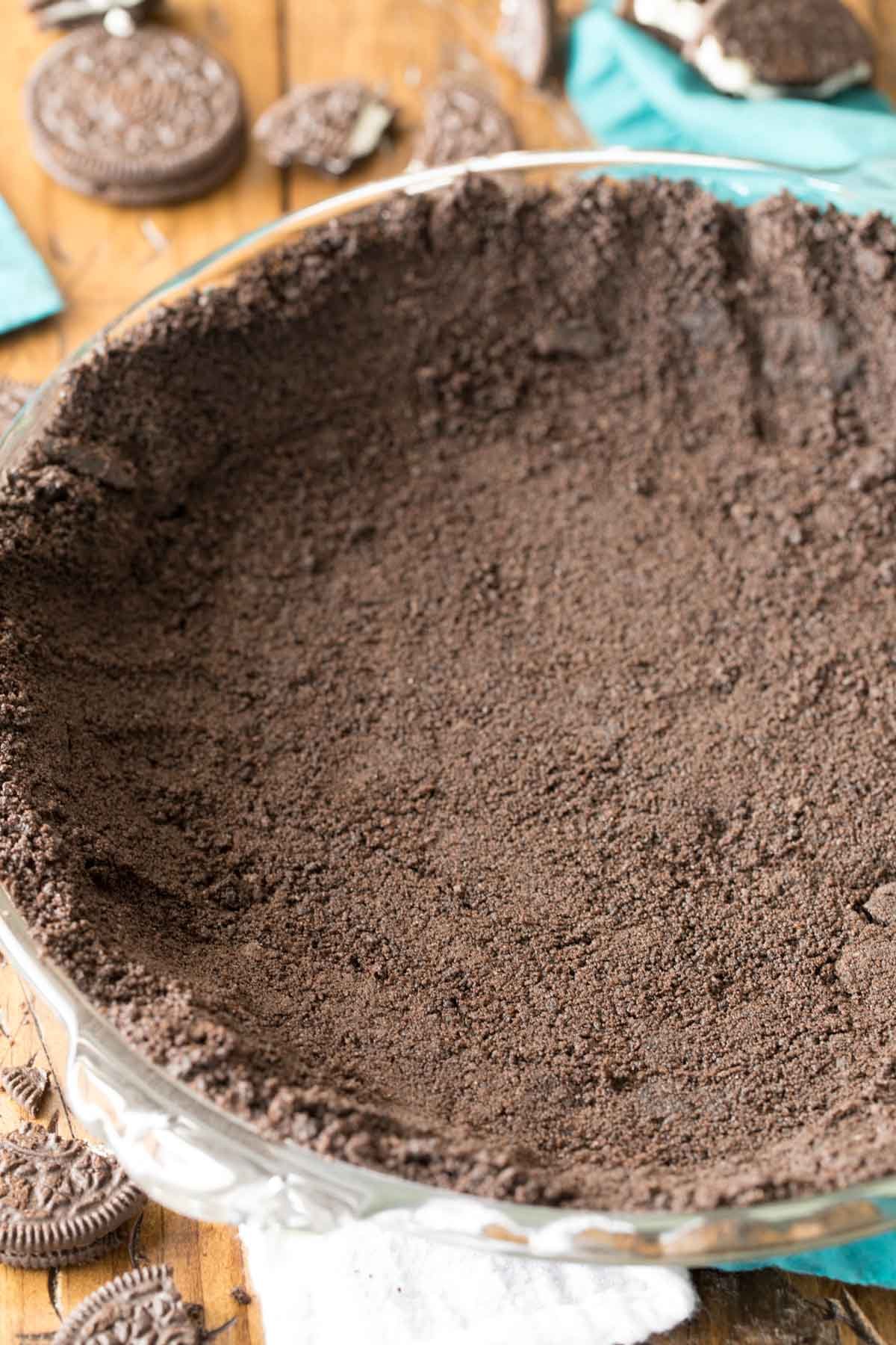 Oreo crumbs that have been pressed into a pie plate to form a crust.