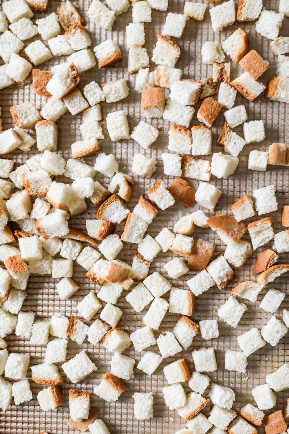 Overhead view of perfectly cut homemade bread cubes for stuffing.