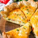 Slices of quiche in a pie plate.
