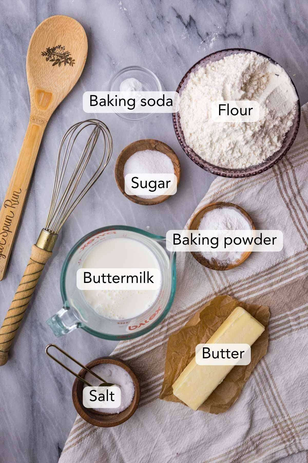 Overhead view of ingredients including flour, butter, buttermilk, and more.